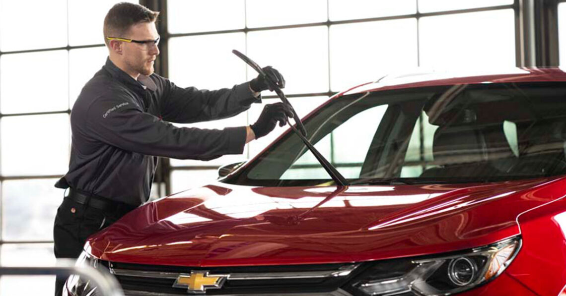 Chevrolet service technician installing new windshield wipers